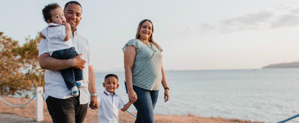 Family walking by the sea