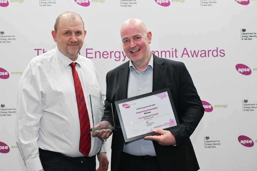 Neil Osborne, Highland Council’s Climate Change & Energy Manager (L)  pictured receiving the award