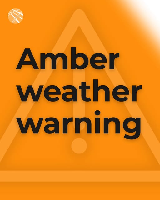 Amber weather warning - bold black text over an orange caution triangle with an exclamation mark on a bright amber background, signalling a severe weather alert.