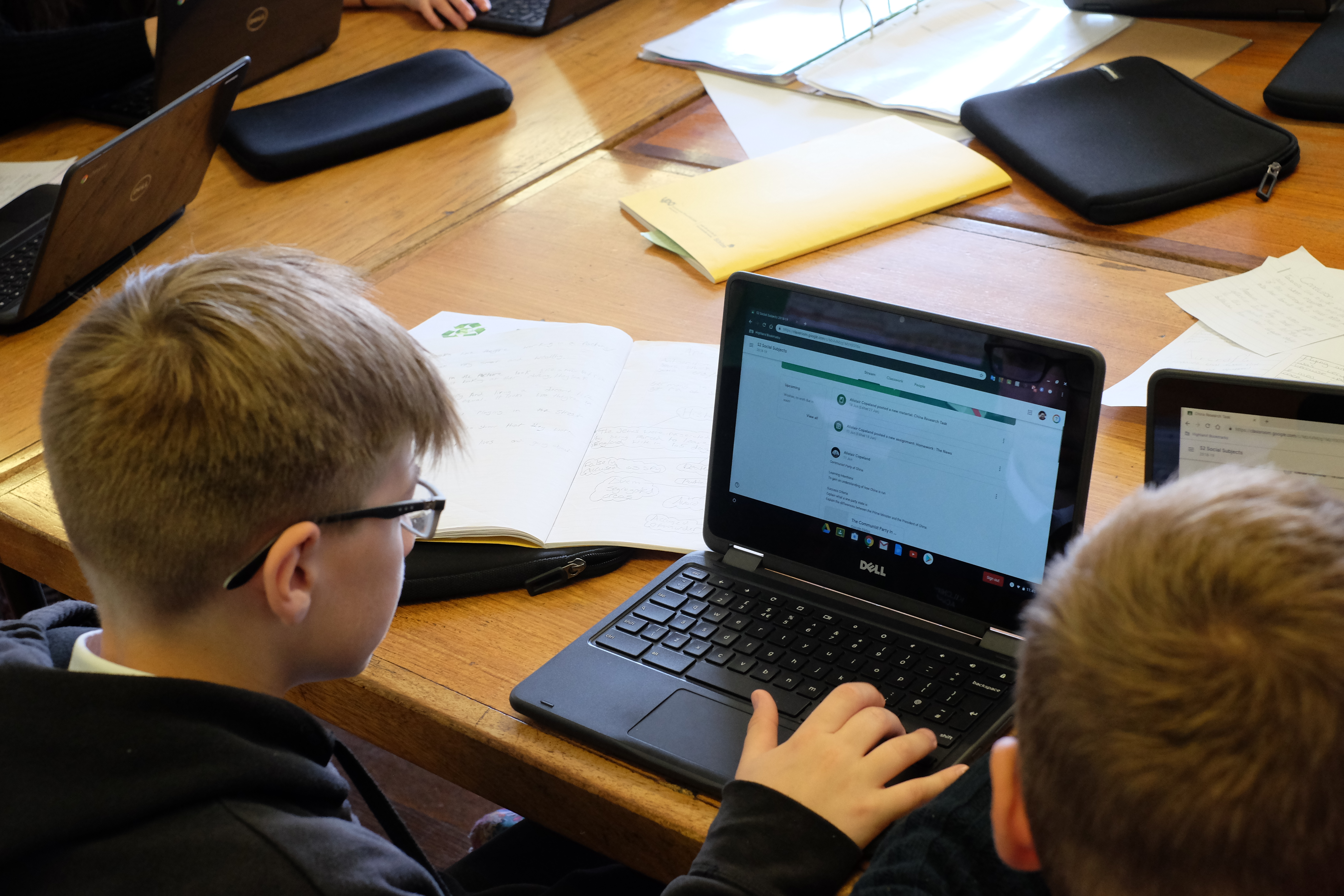 Pupils looking at Chromebooks
