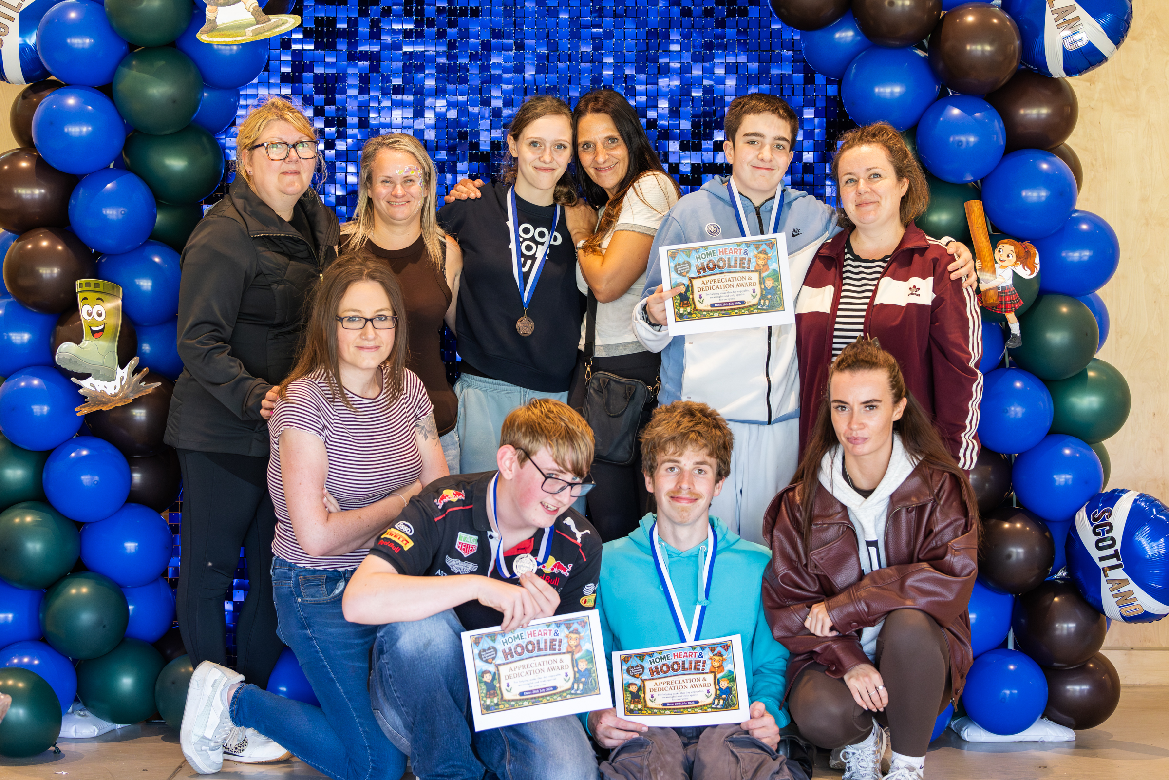 Young people receive their certificates.