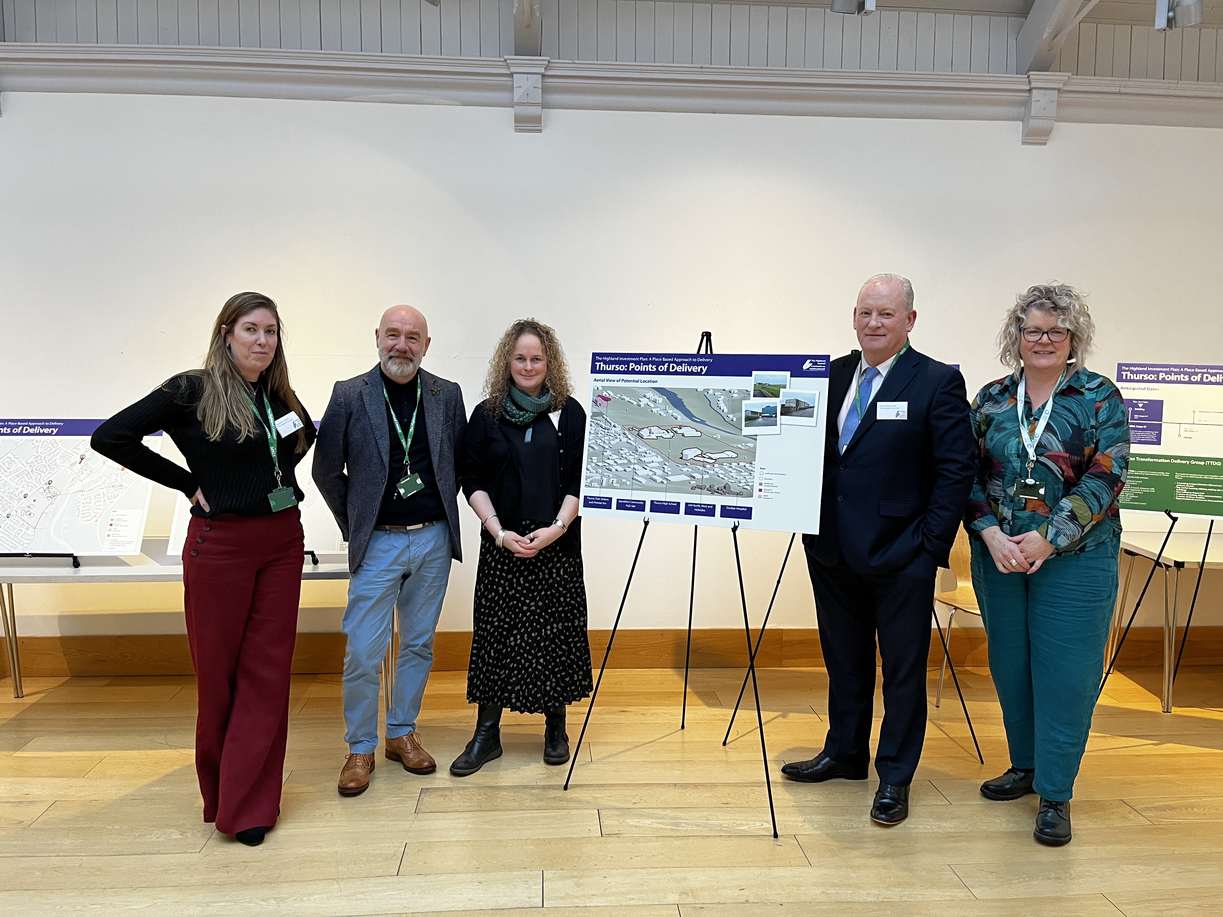 Five people beside a presentation stand on the Thurso Community Point of Delivery (PoD).