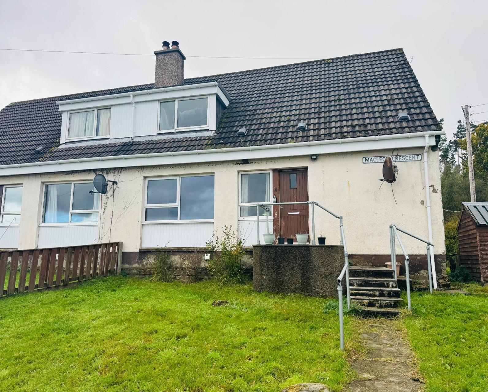 Photograph of end terraced house with garden