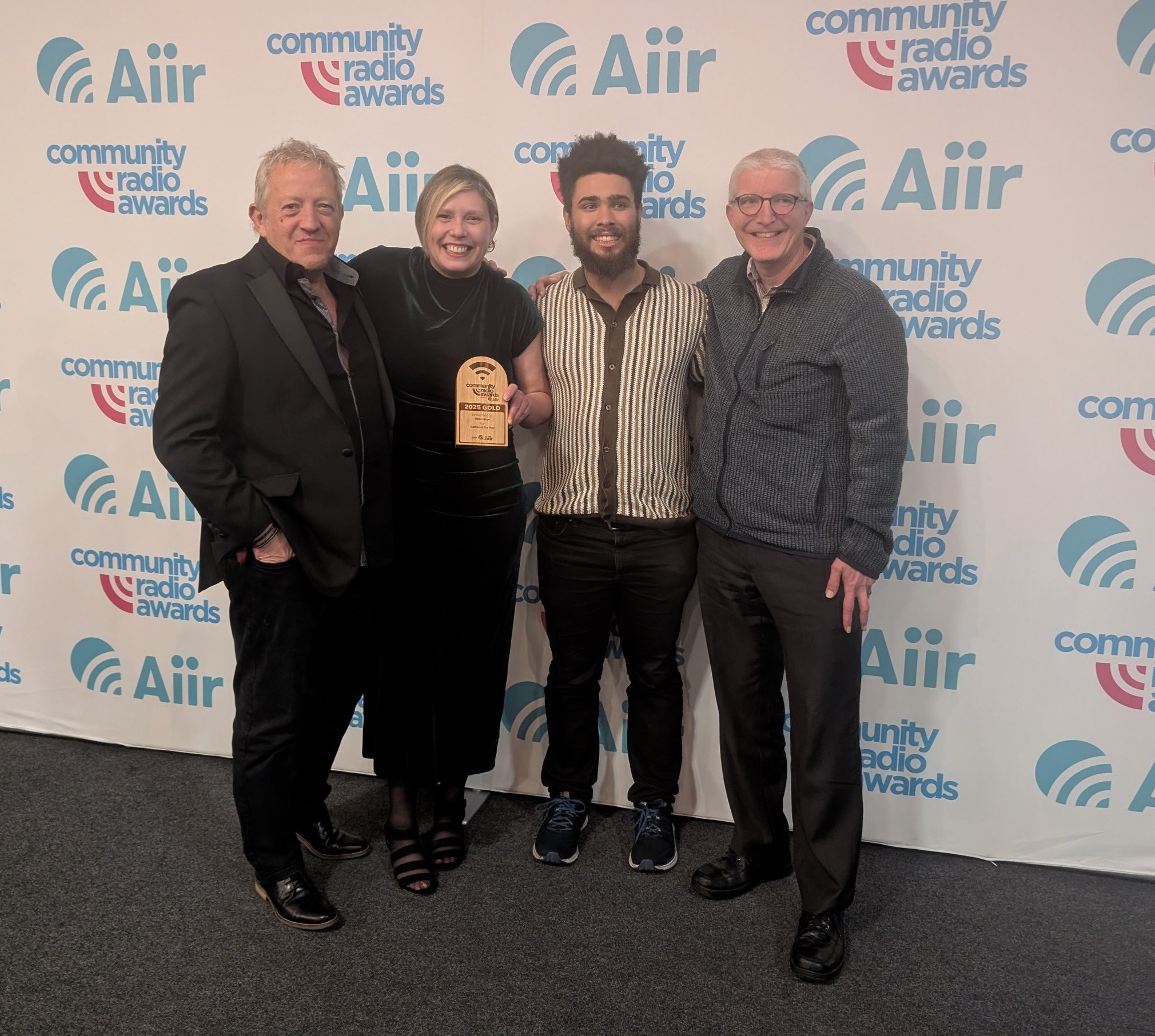 Photo showing Skye Radio team collecting an award