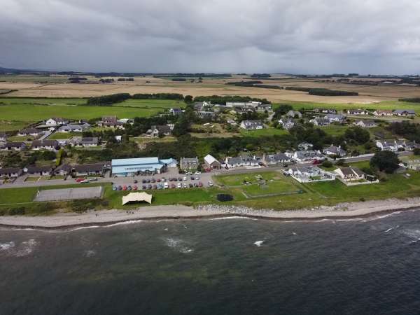 Aerial picture of the Seaboard Memorial Hall, with water in the forefront.
